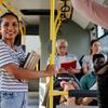 woman on bus holding books