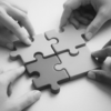 hands holding jigsaw pieces